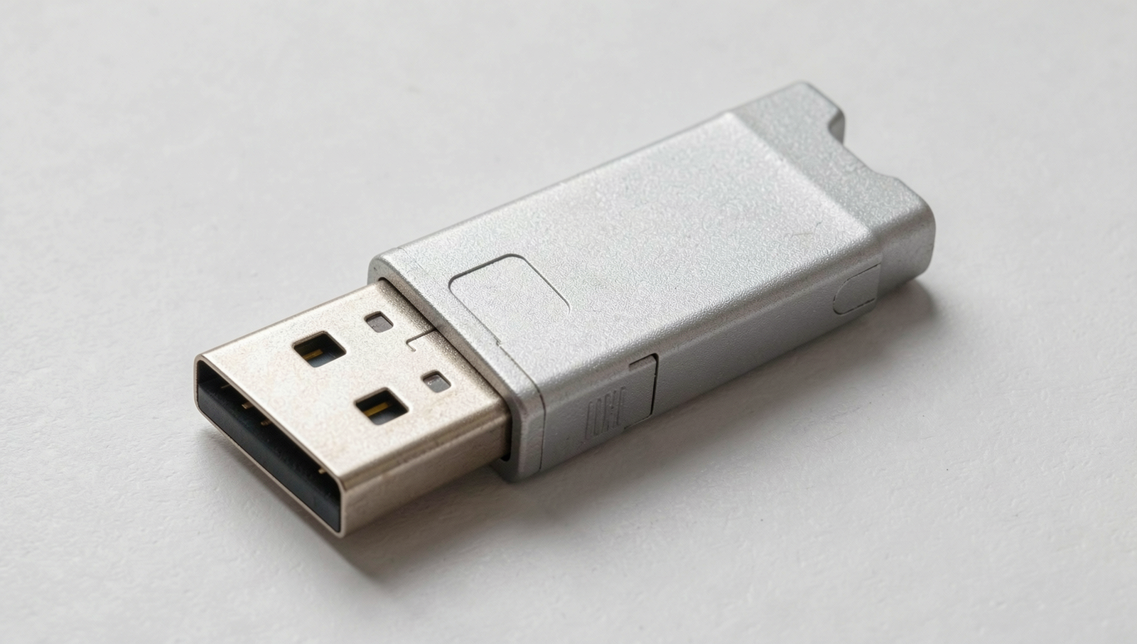 Close-up of an aging USB drive showing wear and tear, illustrating lifespan concerns.