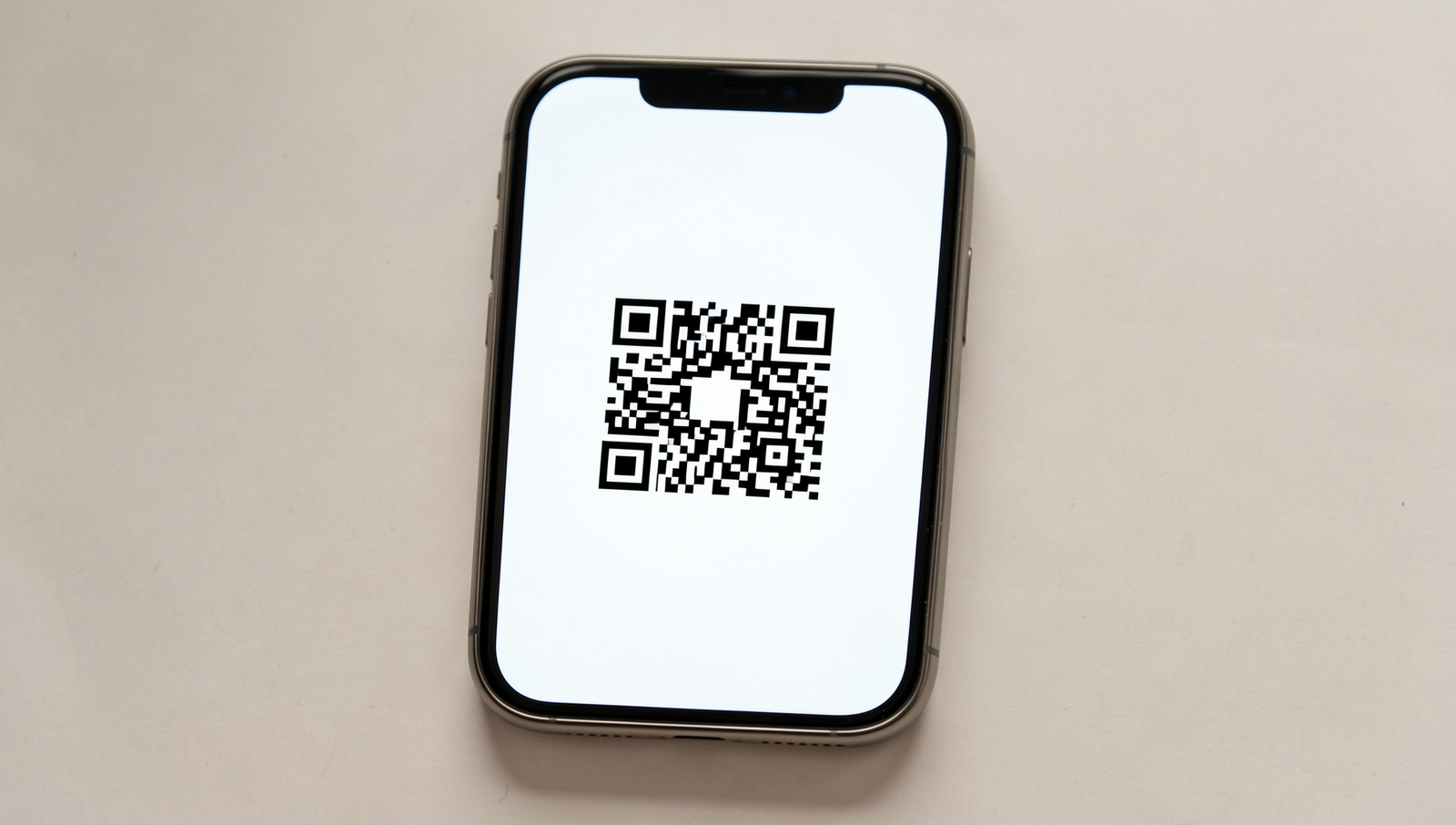 Smartphone scanning a QR code in a well-lit environment.